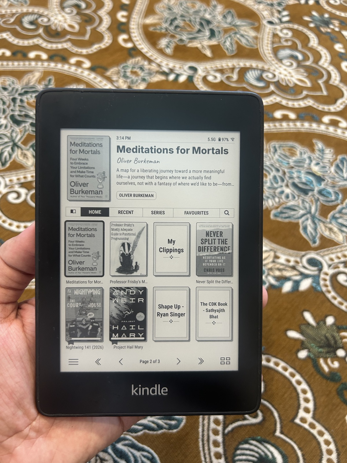 The KOReader home screen on the Kindle showing books, clippings and downloaded documents